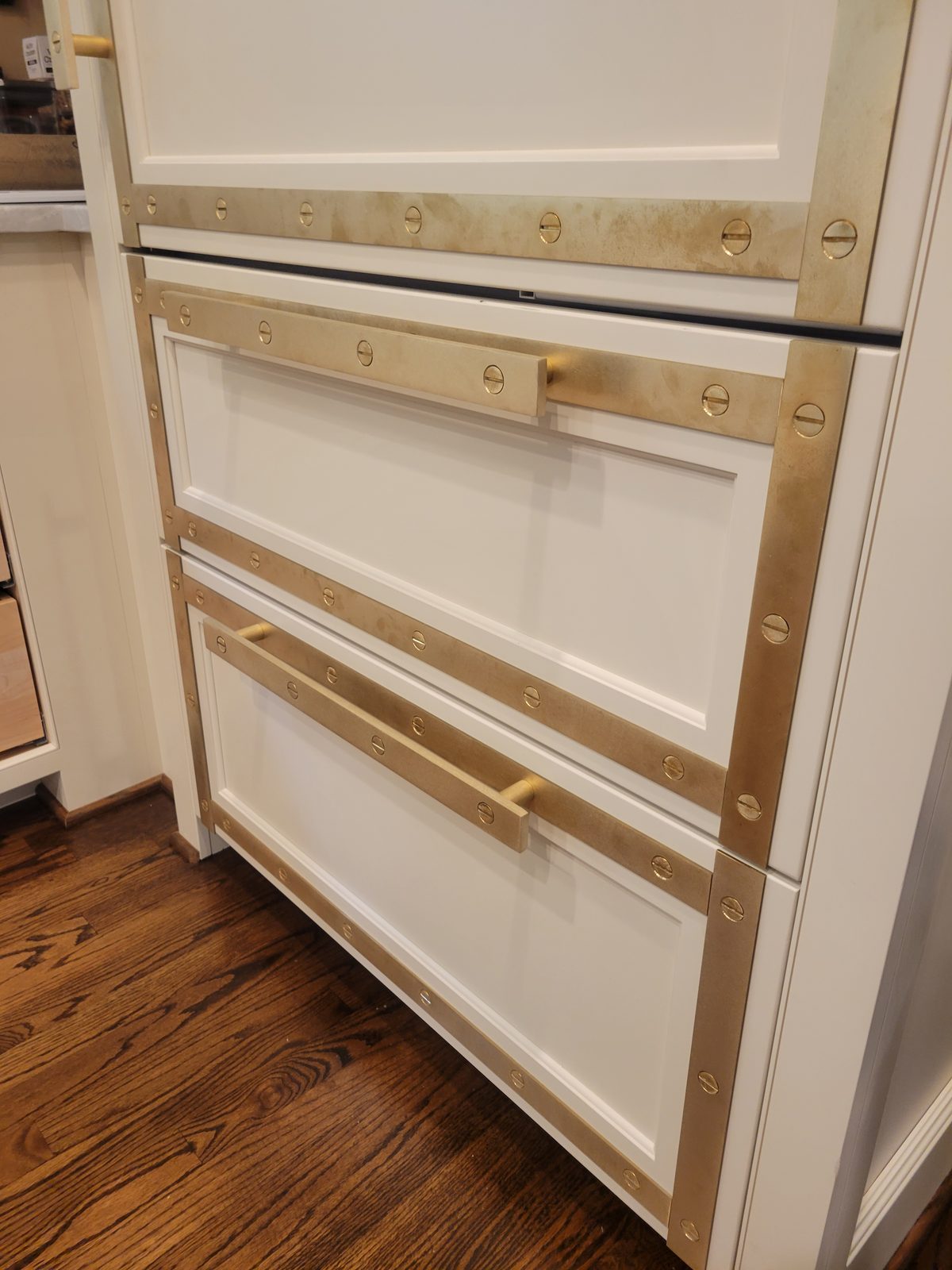 Brass-strapped custom cabinetry